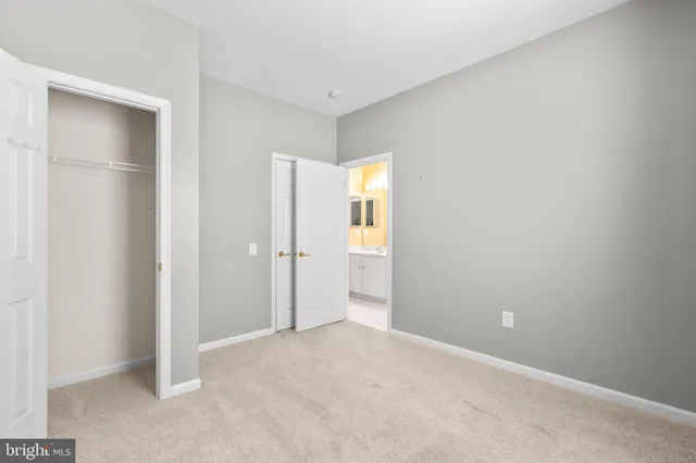 a bedroom with a bed and a potted plant