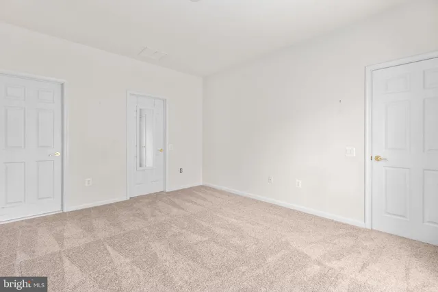a bathroom with a double vanity sink mirror and toilet