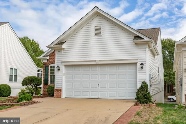a front view of house with garage