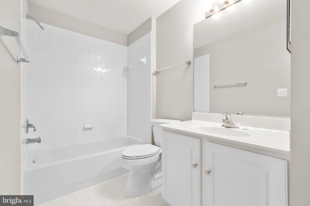 a view of an empty room and wooden floor