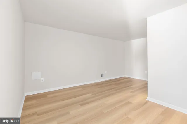 a view of a room with wooden walls
