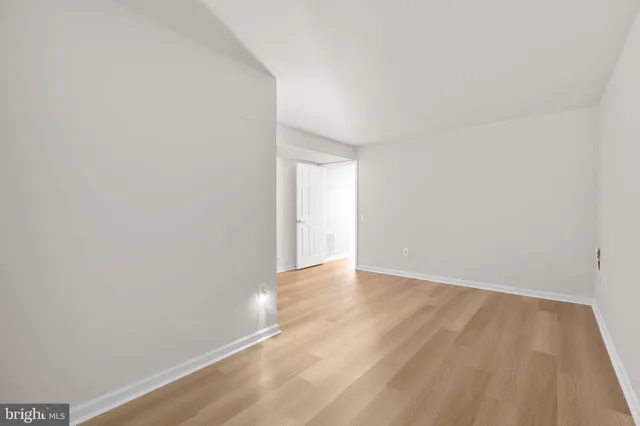 a view of an empty room with wooden walls