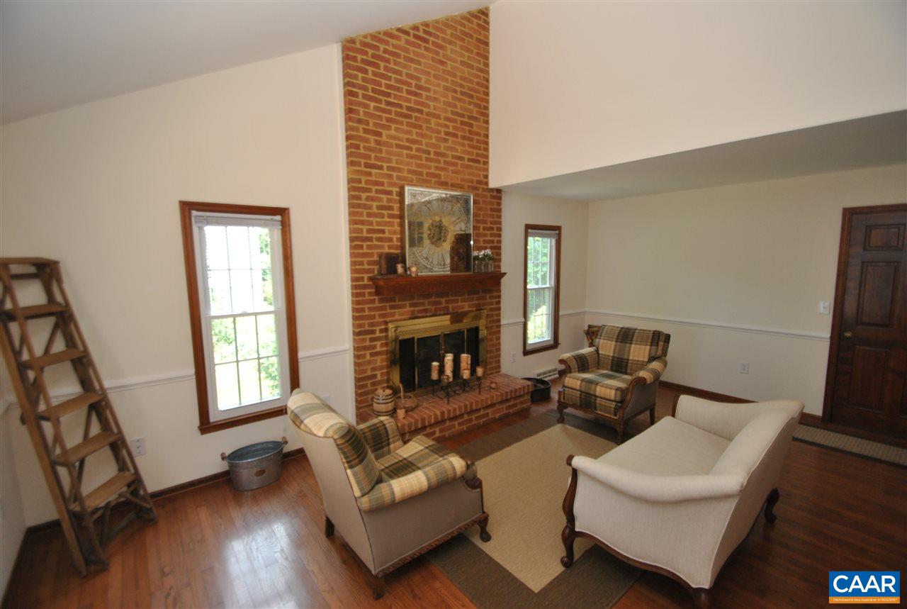 1606 Old Brook Road Charlottesville, VA 22901 - Photo 14 of 32 a living room with furniture and a fireplace