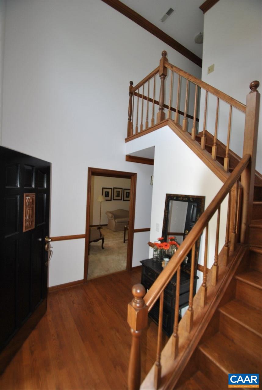 1606 Old Brook Road Charlottesville, VA 22901 - Photo 15 of 32 a view of staircase with lots of furniture and wooden floor