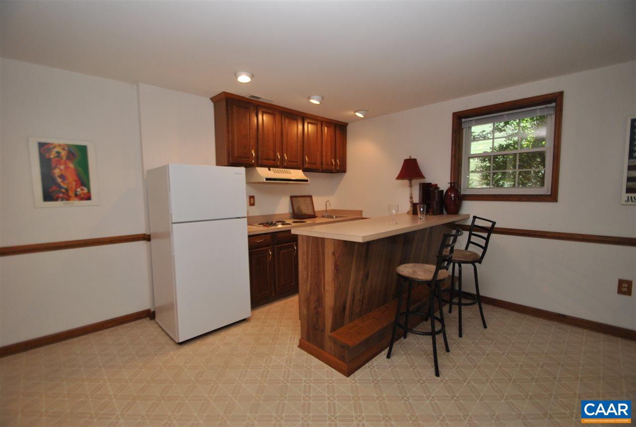 1606 Old Brook Road Charlottesville, VA 22901 - Photo 23 of 32 a kitchen with refrigerator and table