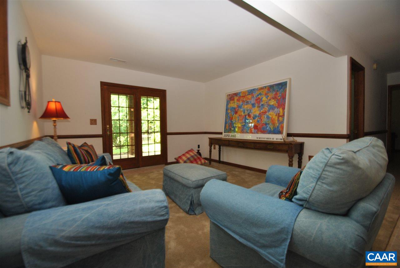 1606 Old Brook Road Charlottesville, VA 22901 - Photo 24 of 32 a living room with furniture chess board and a window