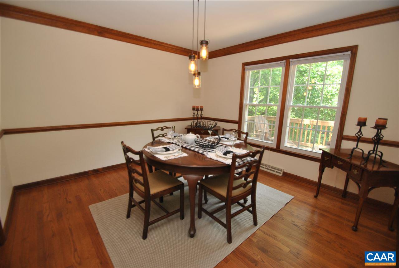 1606 Old Brook Road Charlottesville, VA 22901 - Photo 10 of 32 a view of a dining room with furniture window and wooden floor