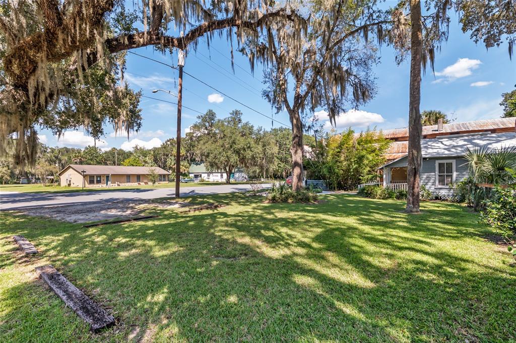 5610 Avenue G McIntosh, FL 32664 - Photo 12 of 64 a view of a yard with a house in the background