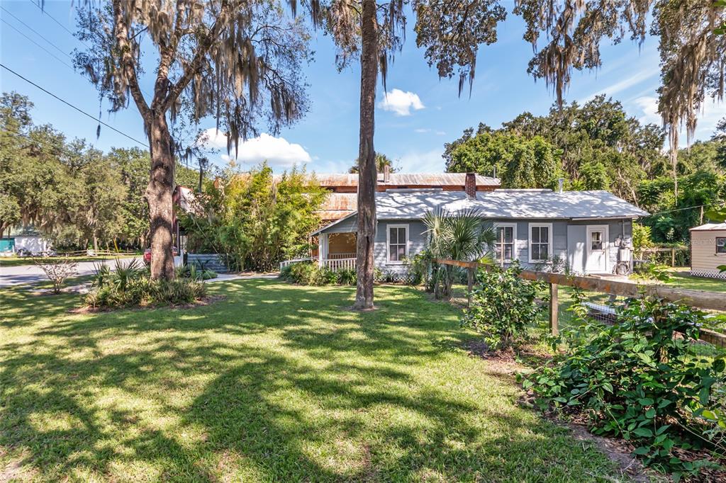5610 Avenue G McIntosh, FL 32664 - Photo 13 of 64 a view of a house with a yard and sitting area