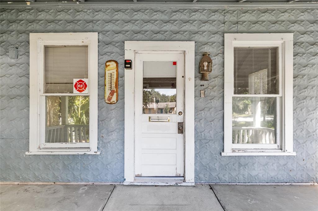 5610 Avenue G McIntosh, FL 32664 - Photo 16 of 64 a front view of a house with an entrance