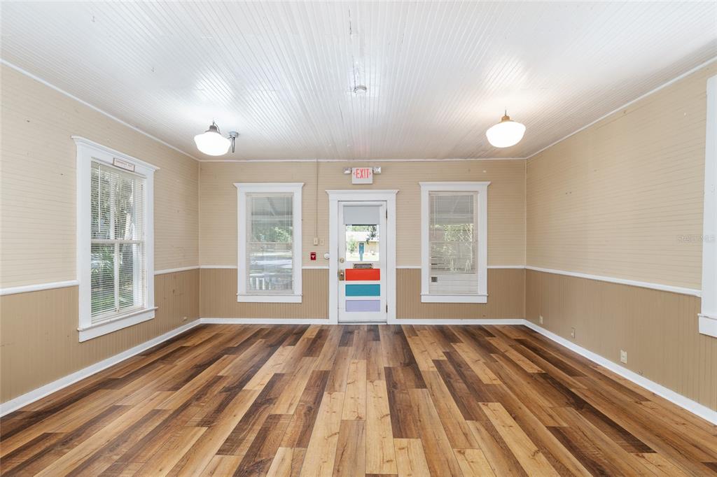 5610 Avenue G McIntosh, FL 32664 - Photo 22 of 64 a view of an empty room with wooden floor and a window
