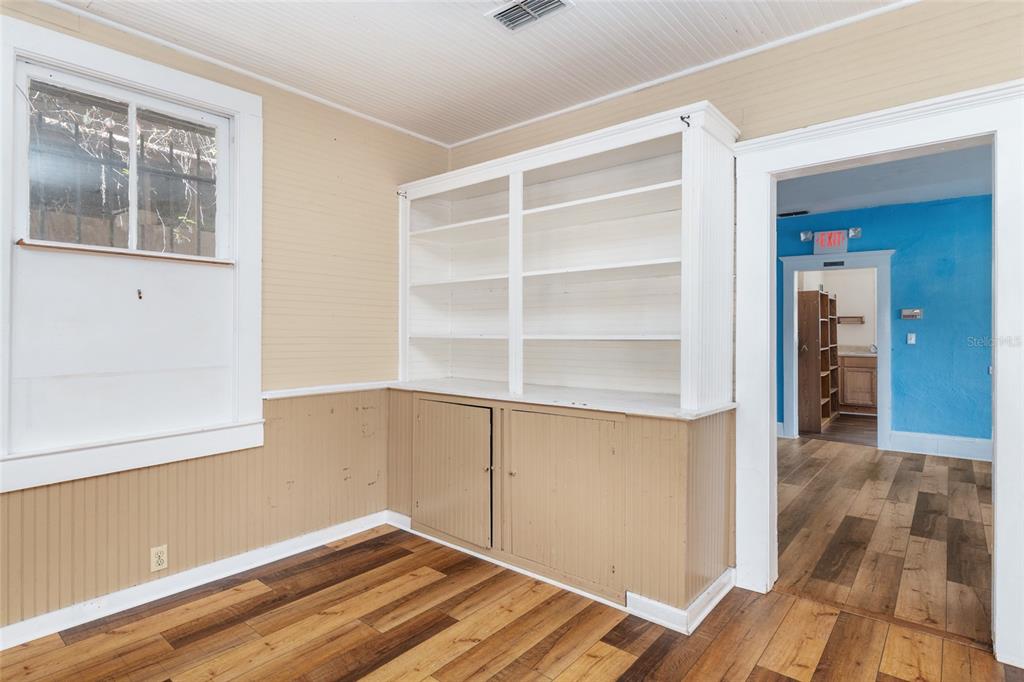 5610 Avenue G McIntosh, FL 32664 - Photo 23 of 64 a view of an empty room with wooden floor and a window