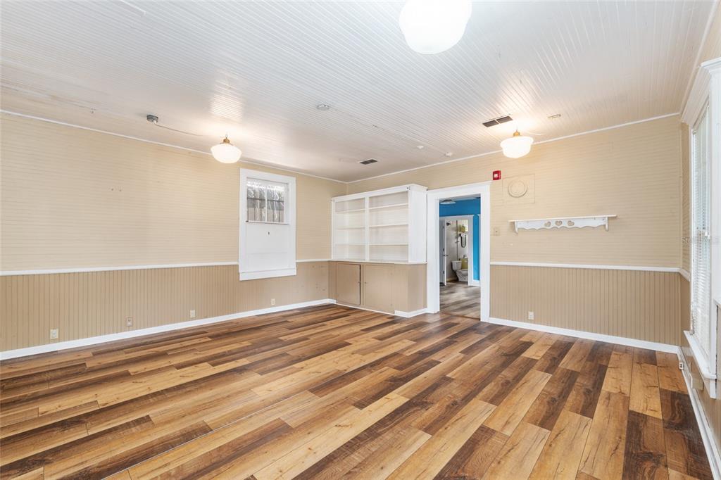 5610 Avenue G McIntosh, FL 32664 - Photo 24 of 64 a view of an empty room with wooden floor and a window