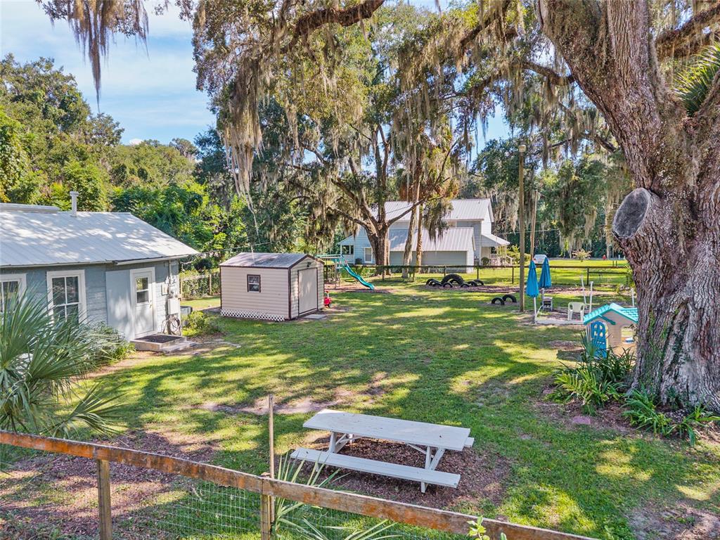 5610 Avenue G McIntosh, FL 32664 - Photo 54 of 64 a front view of a house with garden