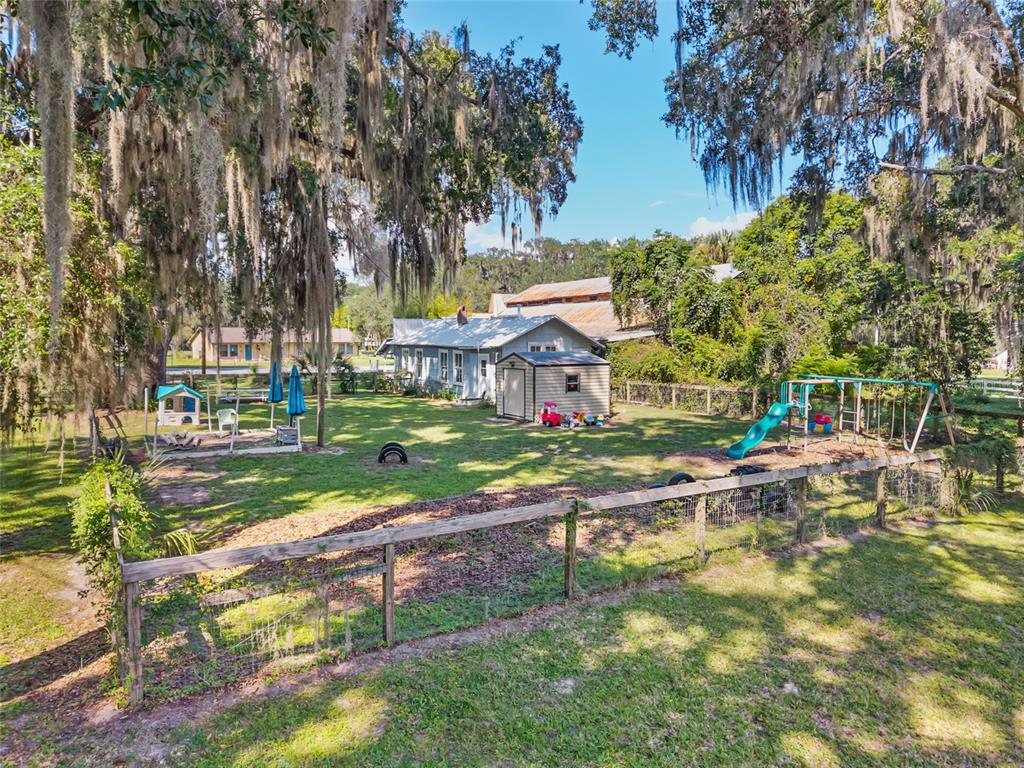 5610 Avenue G McIntosh, FL 32664 - Photo 59 of 64 a view of house with a yard and sitting area