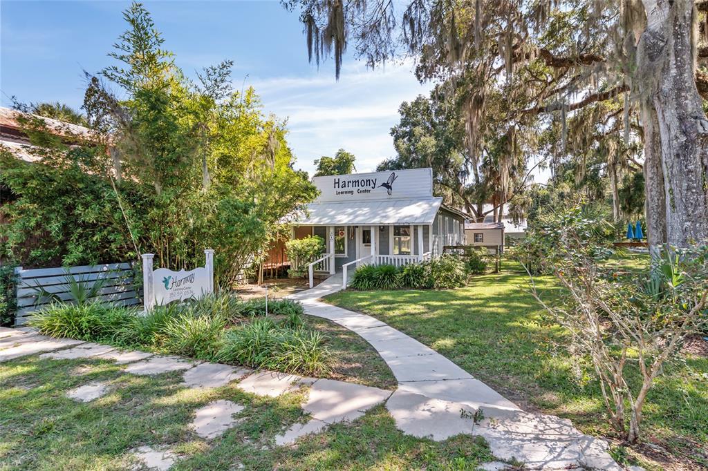 5610 Avenue G McIntosh, FL 32664 - Photo 6 of 64 a front view of a house with a yard table and chairs