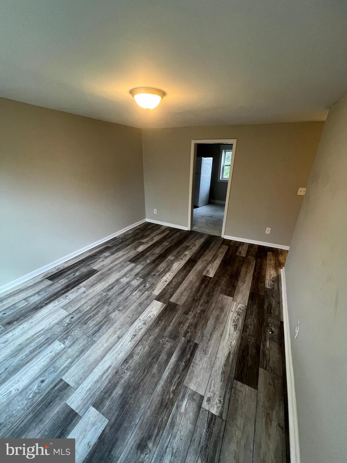 1025 Elton Avenue Baltimore, MD 21224 - Photo 4 of 11 a view of a room with wooden floor