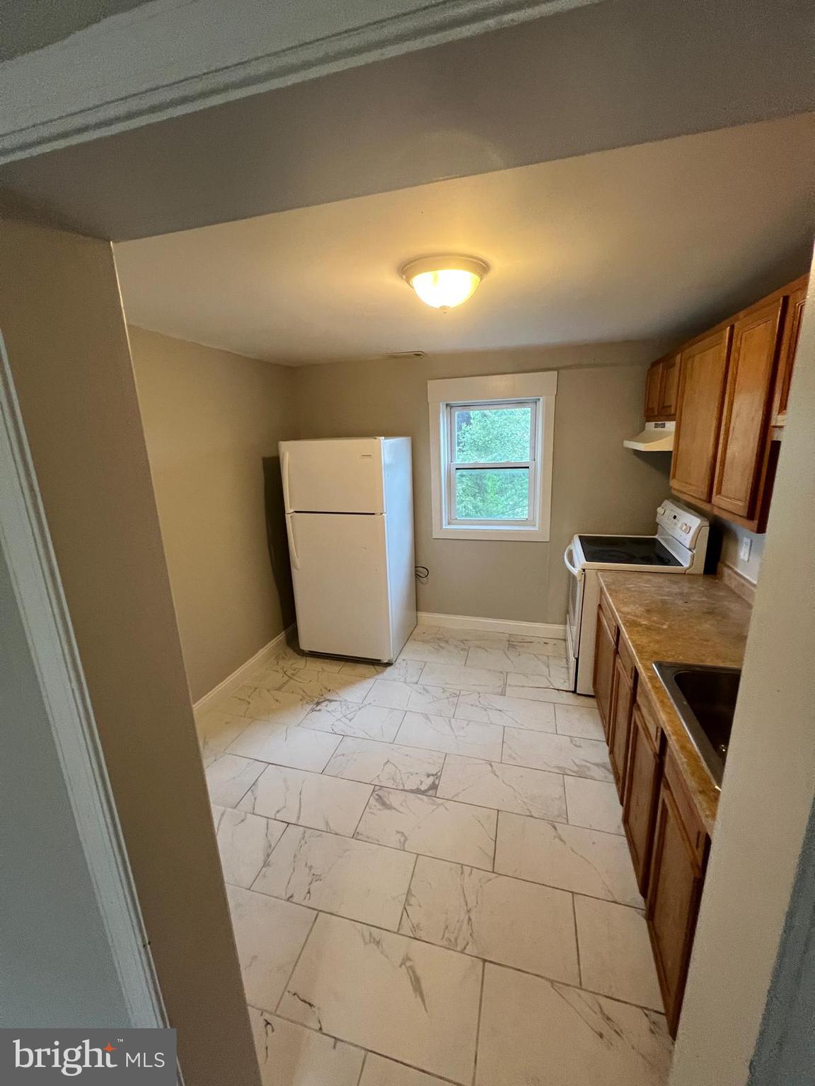 1025 Elton Avenue Baltimore, MD 21224 - Photo 10 of 11 a view of a kitchen from the main door