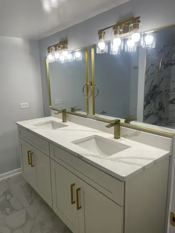 a bathroom with a sink and a mirror