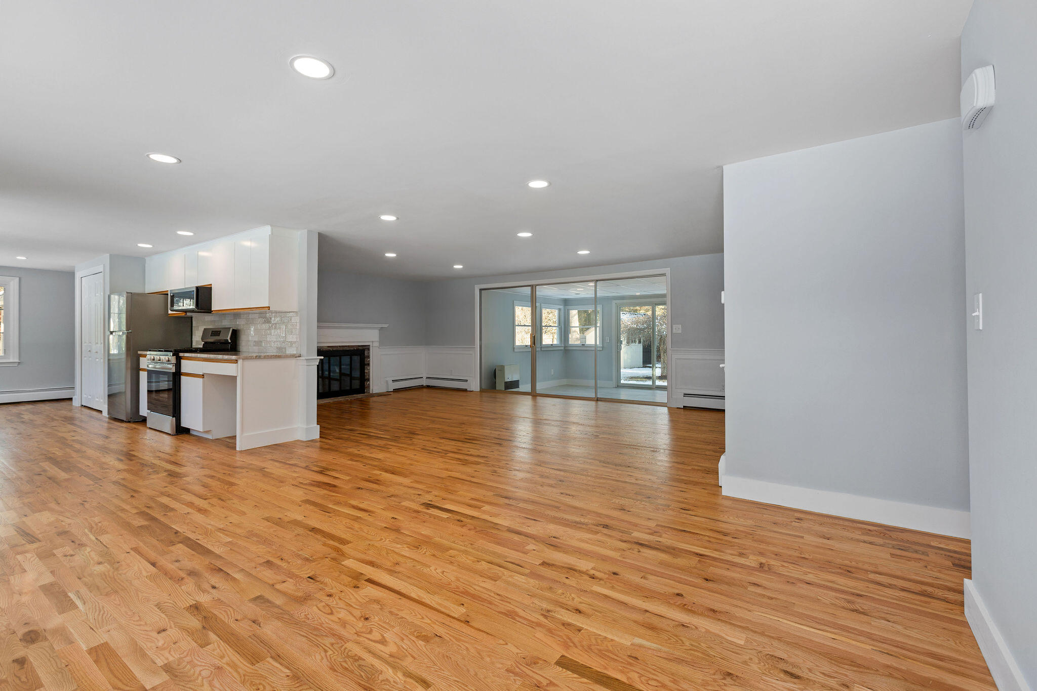 200 Lumbert Mill Road Centerville, MA 02632 - Photo 15 of 63 a view of kitchen with kitchen island wooden floor center island and stainless steel appliances