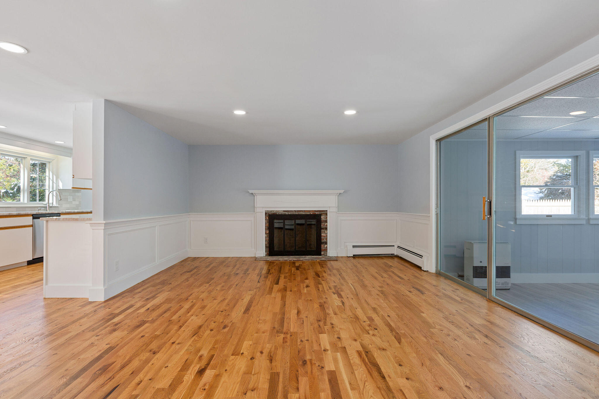 200 Lumbert Mill Road Centerville, MA 02632 - Photo 17 of 63 a view of empty room with wooden floor and fireplace