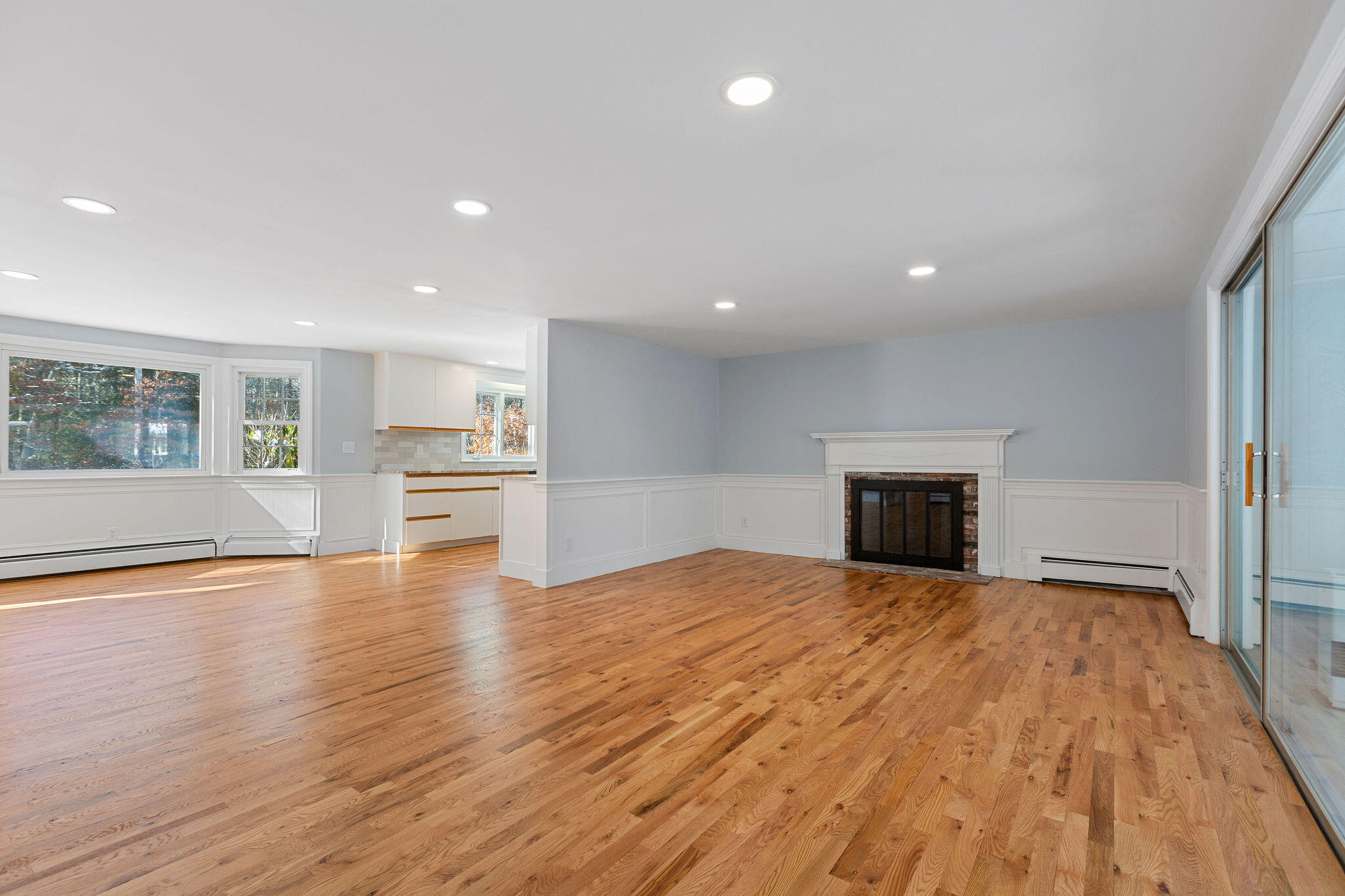 200 Lumbert Mill Road Centerville, MA 02632 - Photo 18 of 63 a view of empty room with wooden floor and fireplace