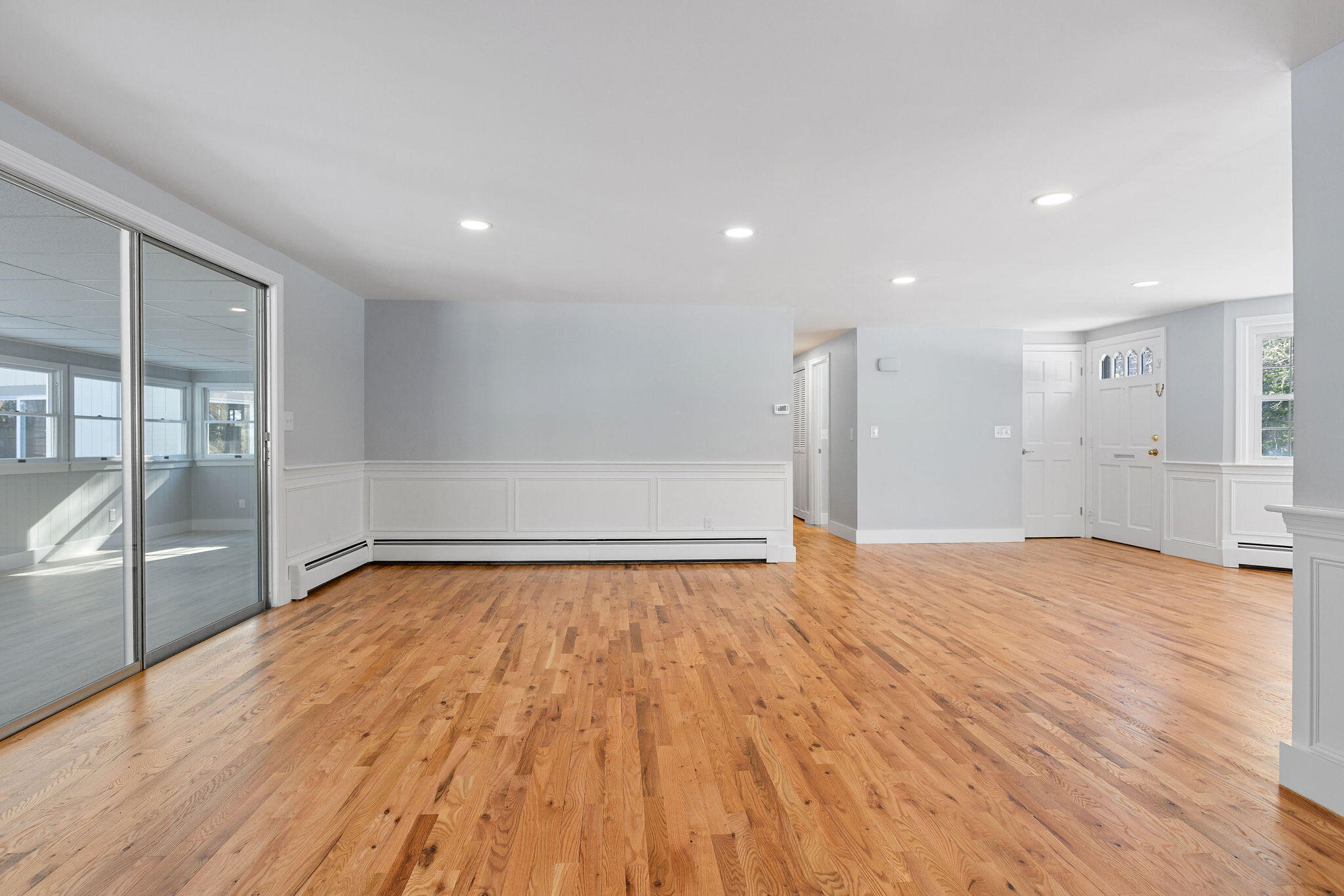 200 Lumbert Mill Road Centerville, MA 02632 - Photo 19 of 63 a view of an empty room with wooden floor and a window