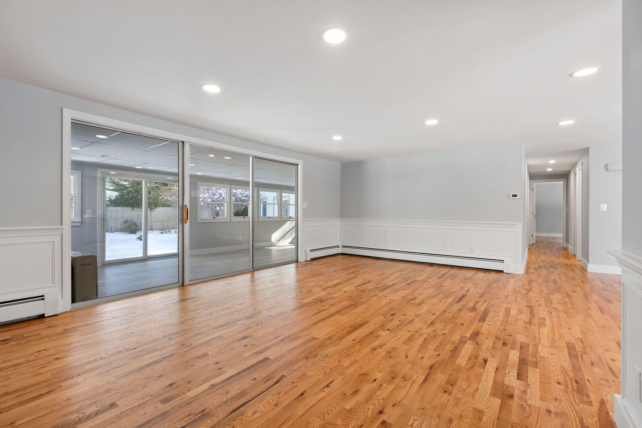 200 Lumbert Mill Road Centerville, MA 02632 - Photo 20 of 63 a view of an empty room with wooden floor and a window