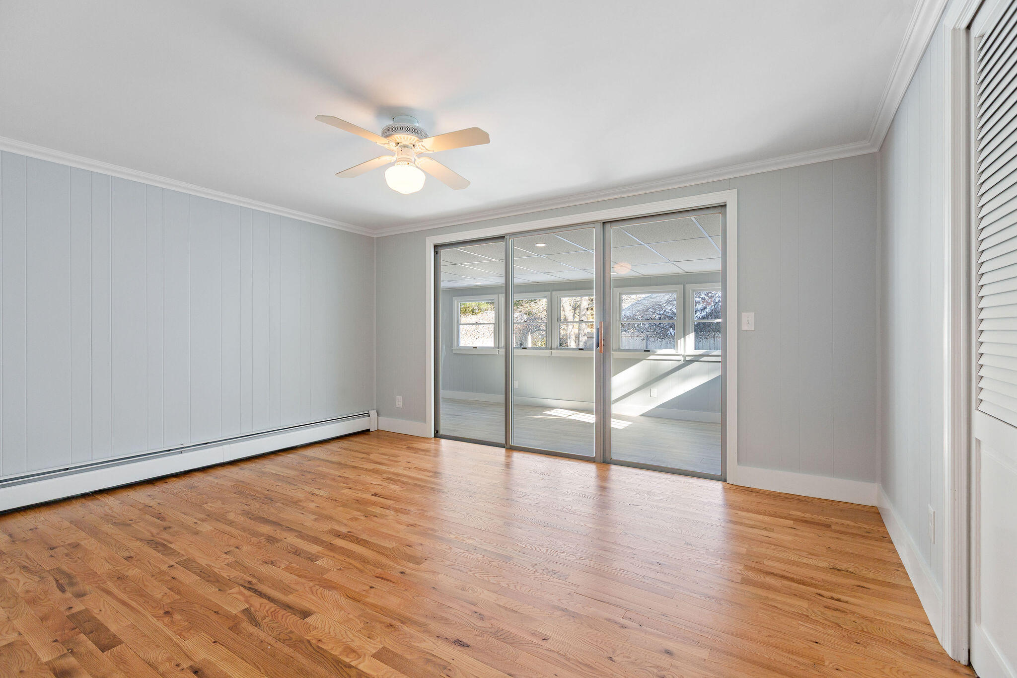 200 Lumbert Mill Road Centerville, MA 02632 - Photo 22 of 63 wooden floor in an empty room with a window