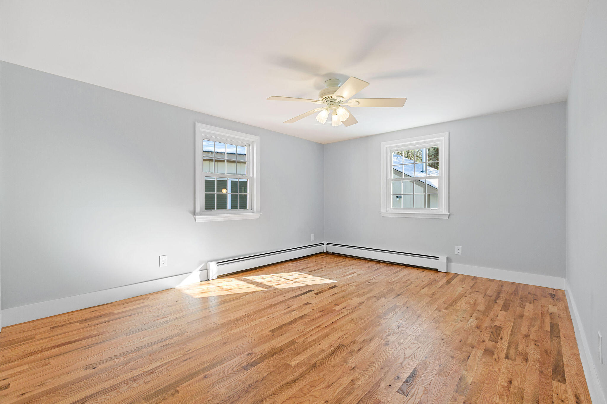 200 Lumbert Mill Road Centerville, MA 02632 - Photo 27 of 63 a view of empty room with wooden floor and fan
