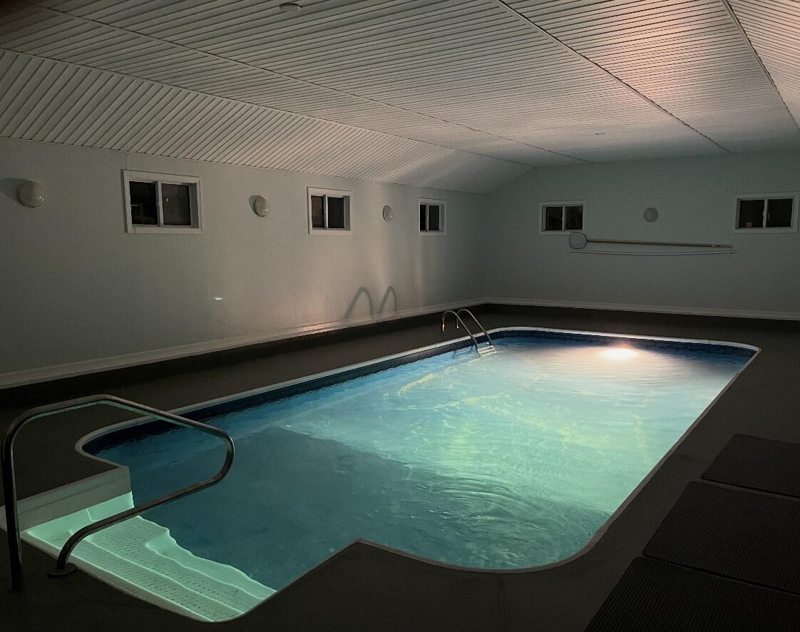 200 Lumbert Mill Road Centerville, MA 02632 - Photo 3 of 63 a view of a pool in a room