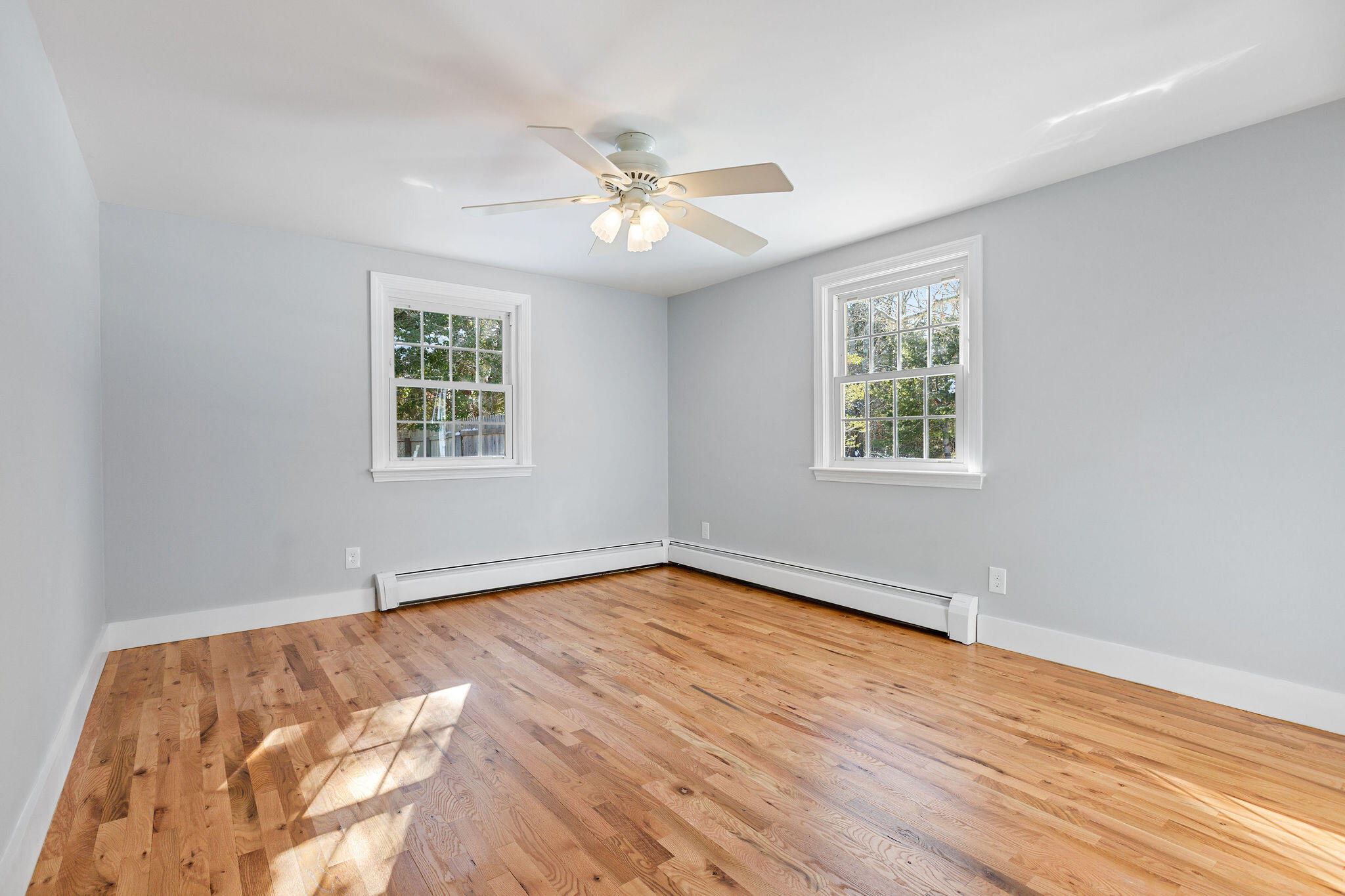 200 Lumbert Mill Road Centerville, MA 02632 - Photo 33 of 63 a view of an empty room with wooden floor and a window