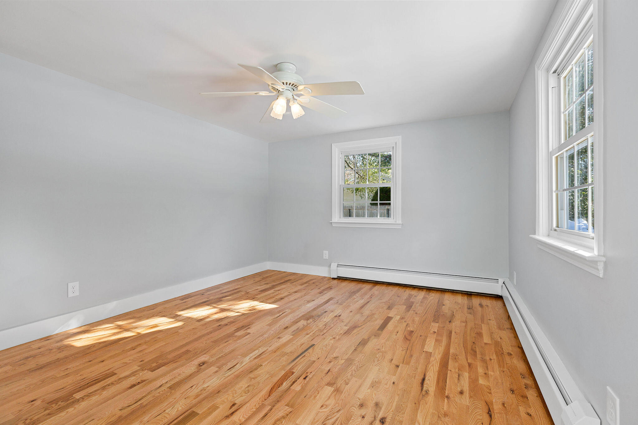 200 Lumbert Mill Road Centerville, MA 02632 - Photo 35 of 63 a view of empty room with wooden floor and fan