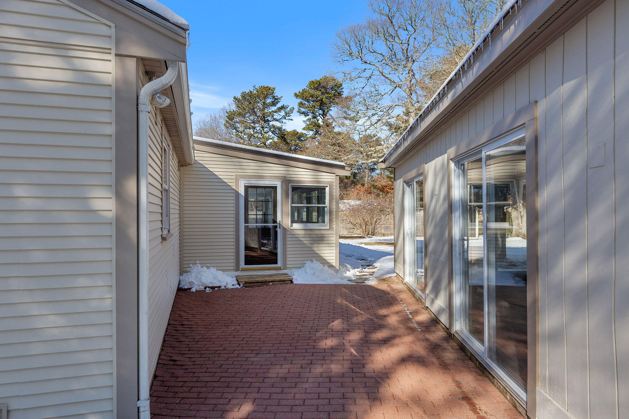 200 Lumbert Mill Road Centerville, MA 02632 - Photo 52 of 63 a view of a porch with a table and chairs