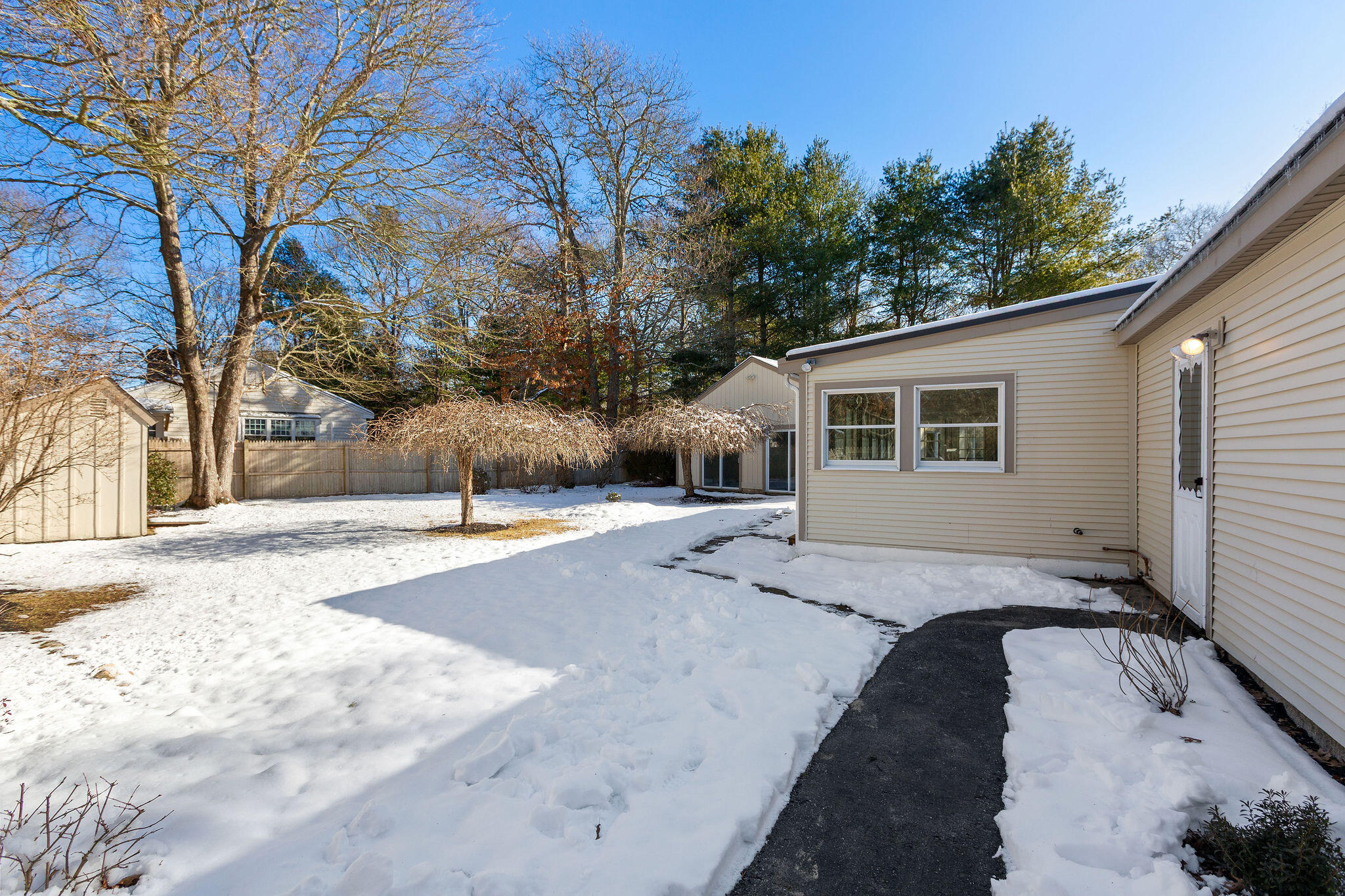 200 Lumbert Mill Road Centerville, MA 02632 - Photo 53 of 63 a view of a house with snow on the road