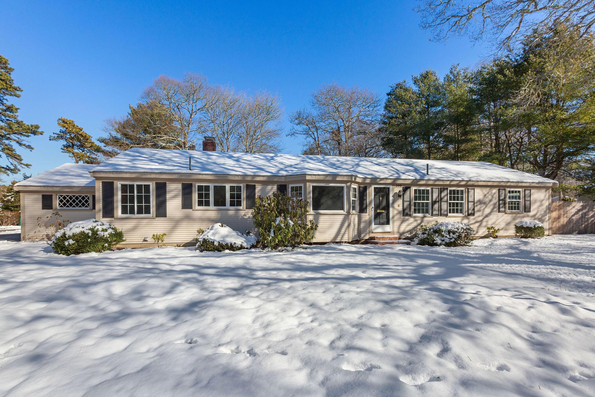 200 Lumbert Mill Road Centerville, MA 02632 - Photo 54 of 63 a front view of a house with a garden and balcony