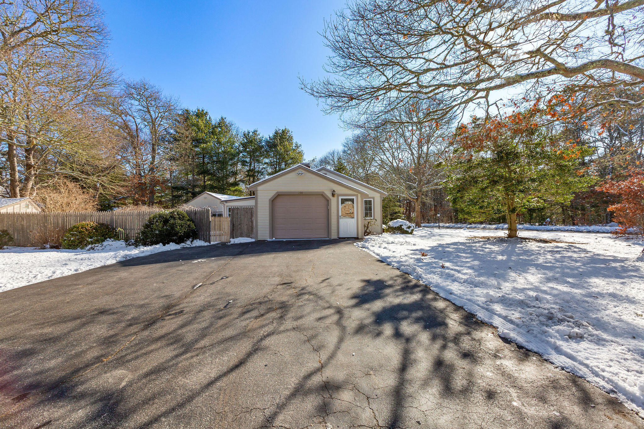 200 Lumbert Mill Road Centerville, MA 02632 - Photo 6 of 63 a front view of house with a yard and trees