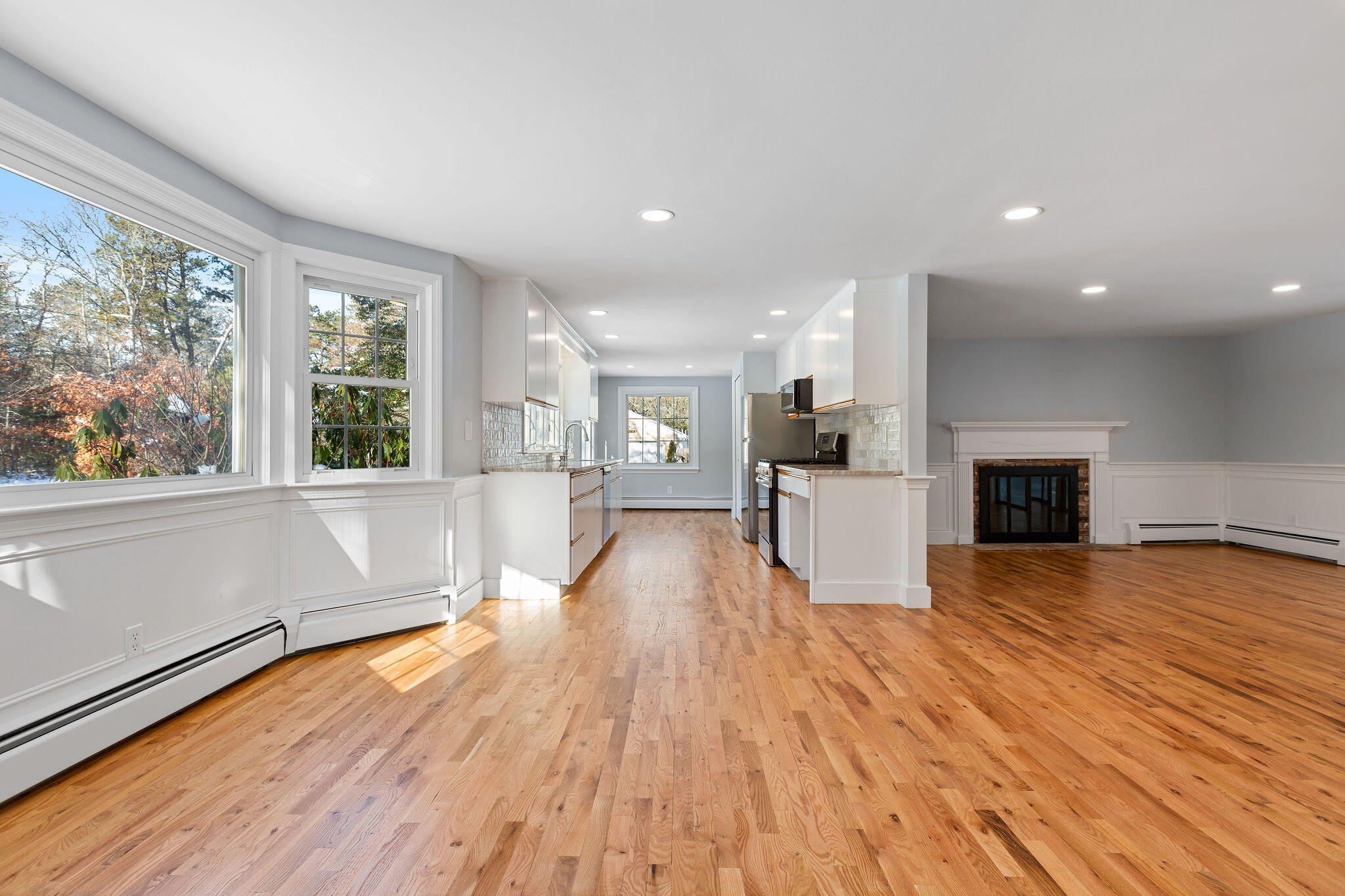 200 Lumbert Mill Road Centerville, MA 02632 - Photo 8 of 63 a view of a kitchen with wooden floor and a window