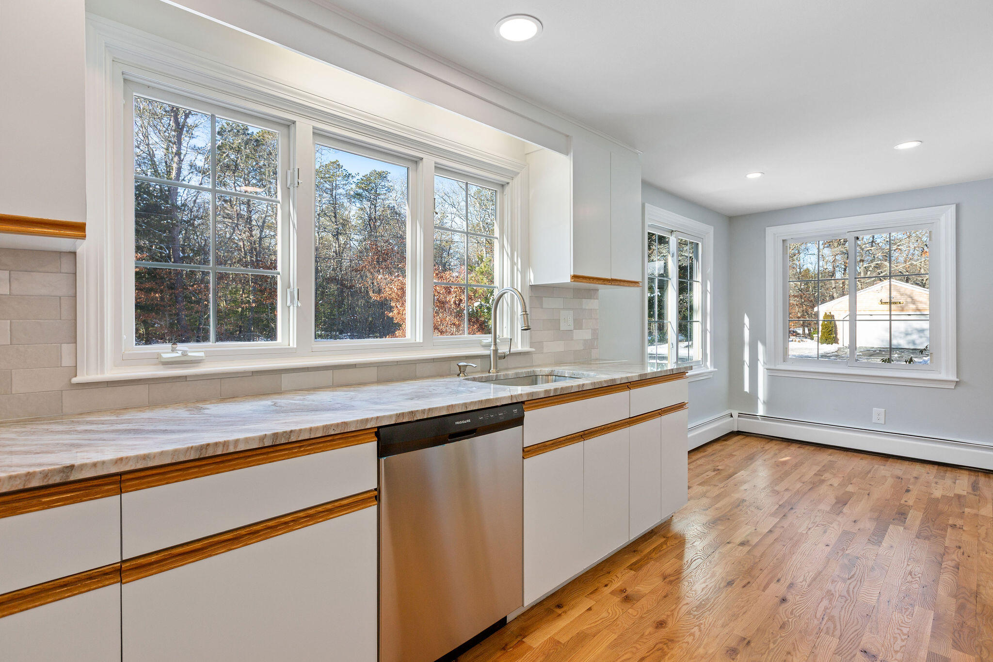 200 Lumbert Mill Road Centerville, MA 02632 - Photo 10 of 63 a kitchen with granite countertop a stove and a sink