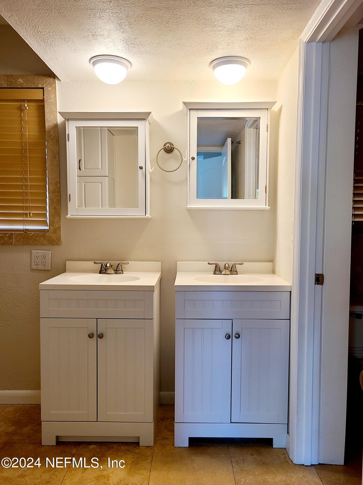 4620 Morris Road Jacksonville, FL 32225 - Photo 15 of 39 a bathroom with a sink and a mirror