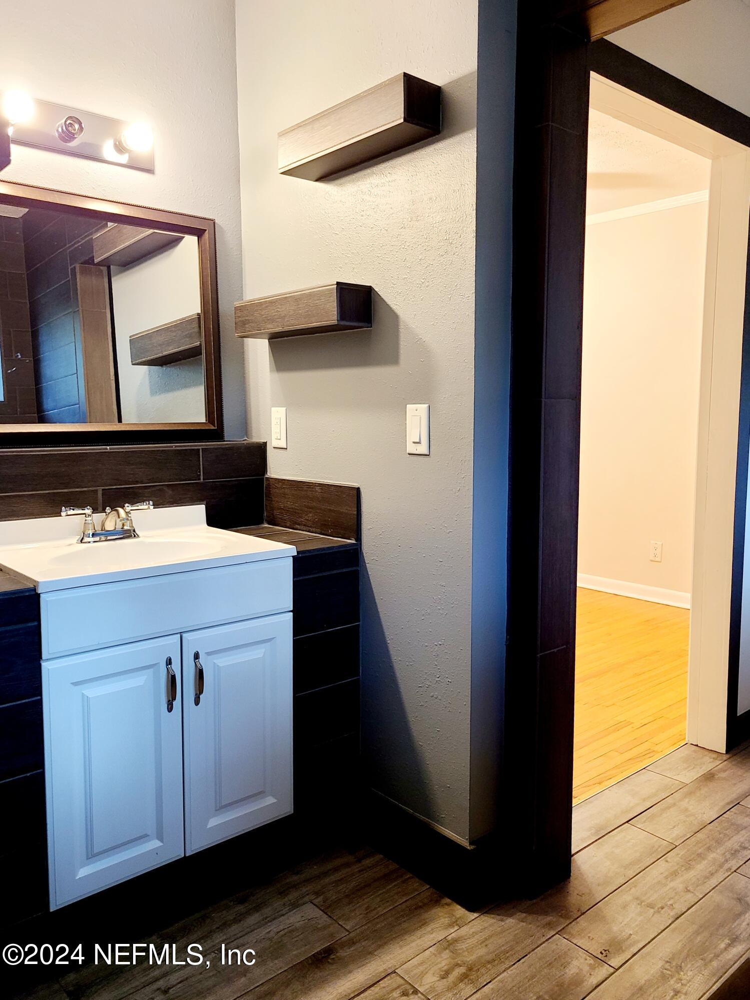 4620 Morris Road Jacksonville, FL 32225 - Photo 21 of 39 a bathroom with a sink and a mirror