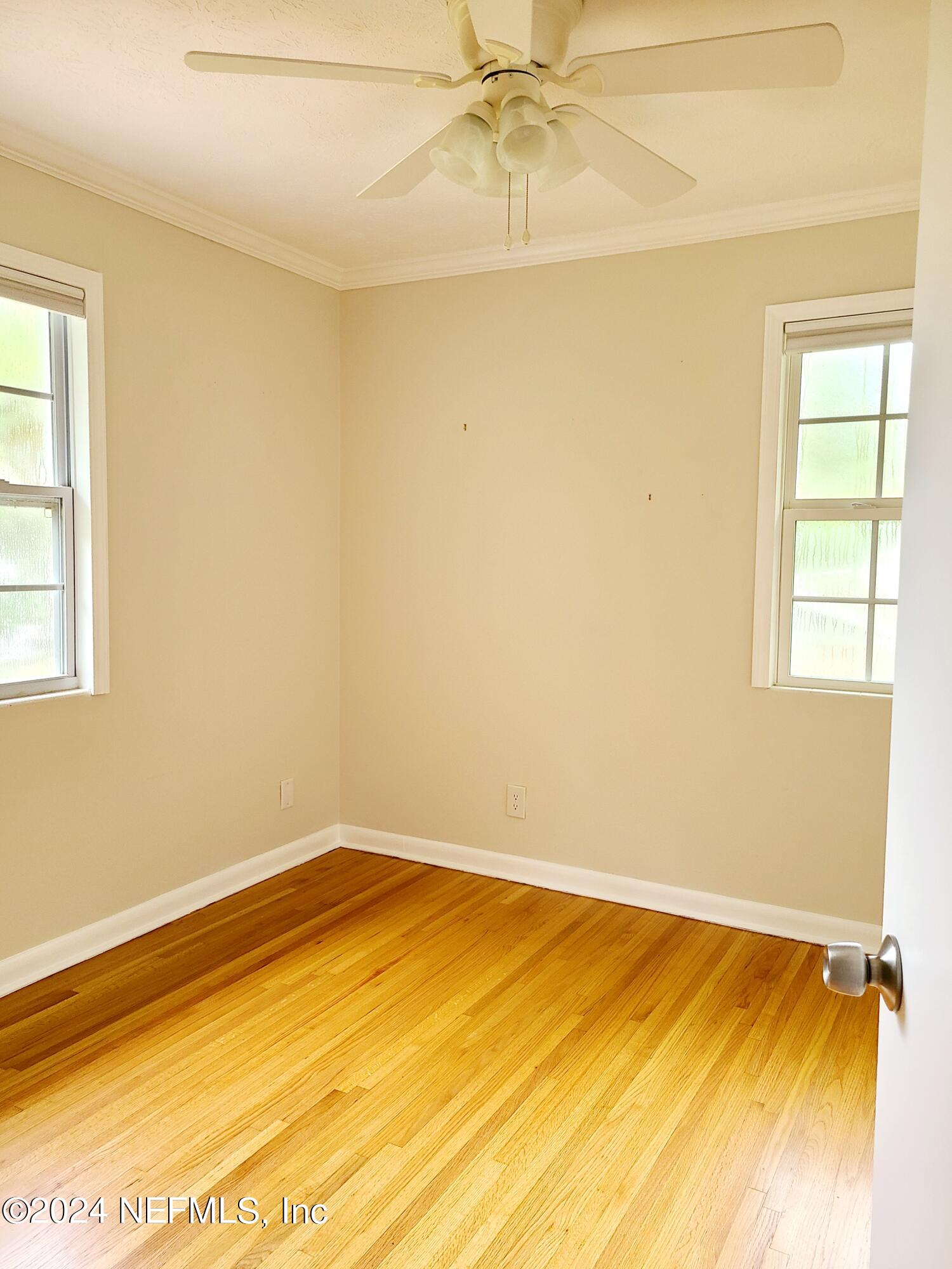 4620 Morris Road Jacksonville, FL 32225 - Photo 30 of 39 a view of a room with wooden floor and a window