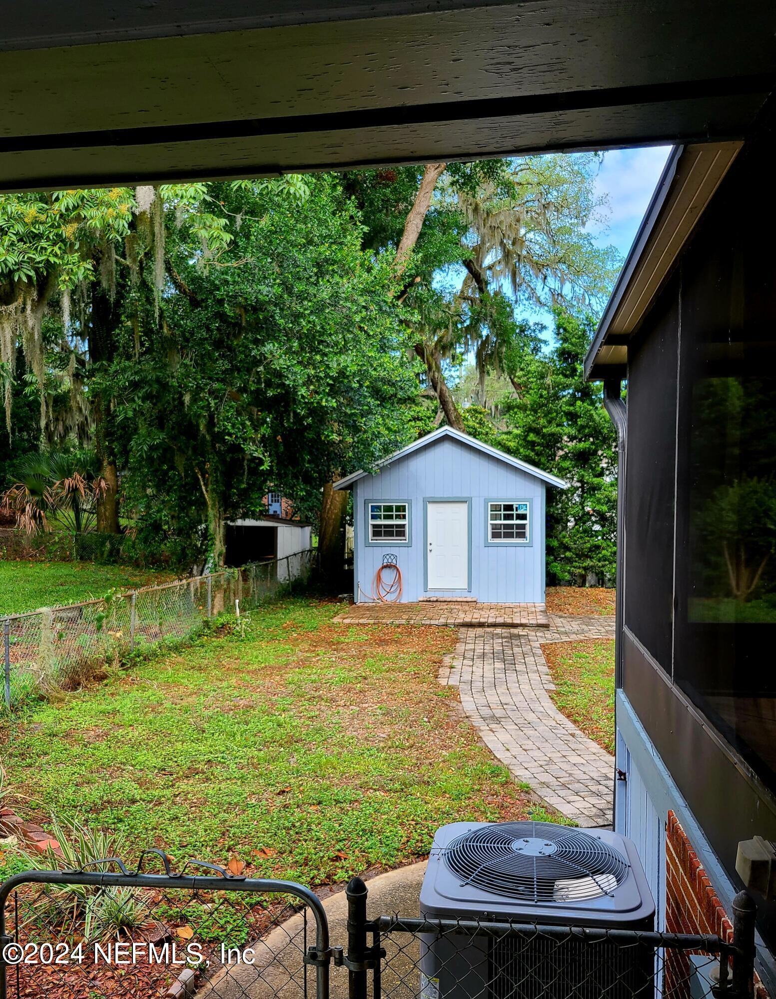 4620 Morris Road Jacksonville, FL 32225 - Photo 31 of 39 a view of backyard with swimming pool and outdoor seating