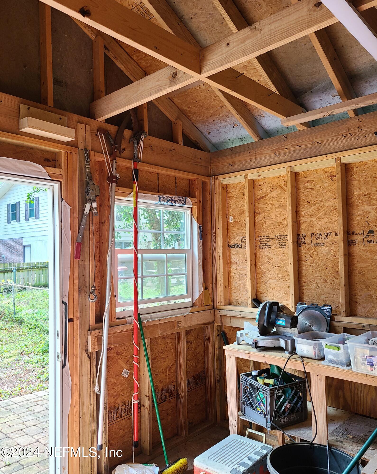 4620 Morris Road Jacksonville, FL 32225 - Photo 33 of 39 a view of a dining room with furniture a chandelier and wooden floor
