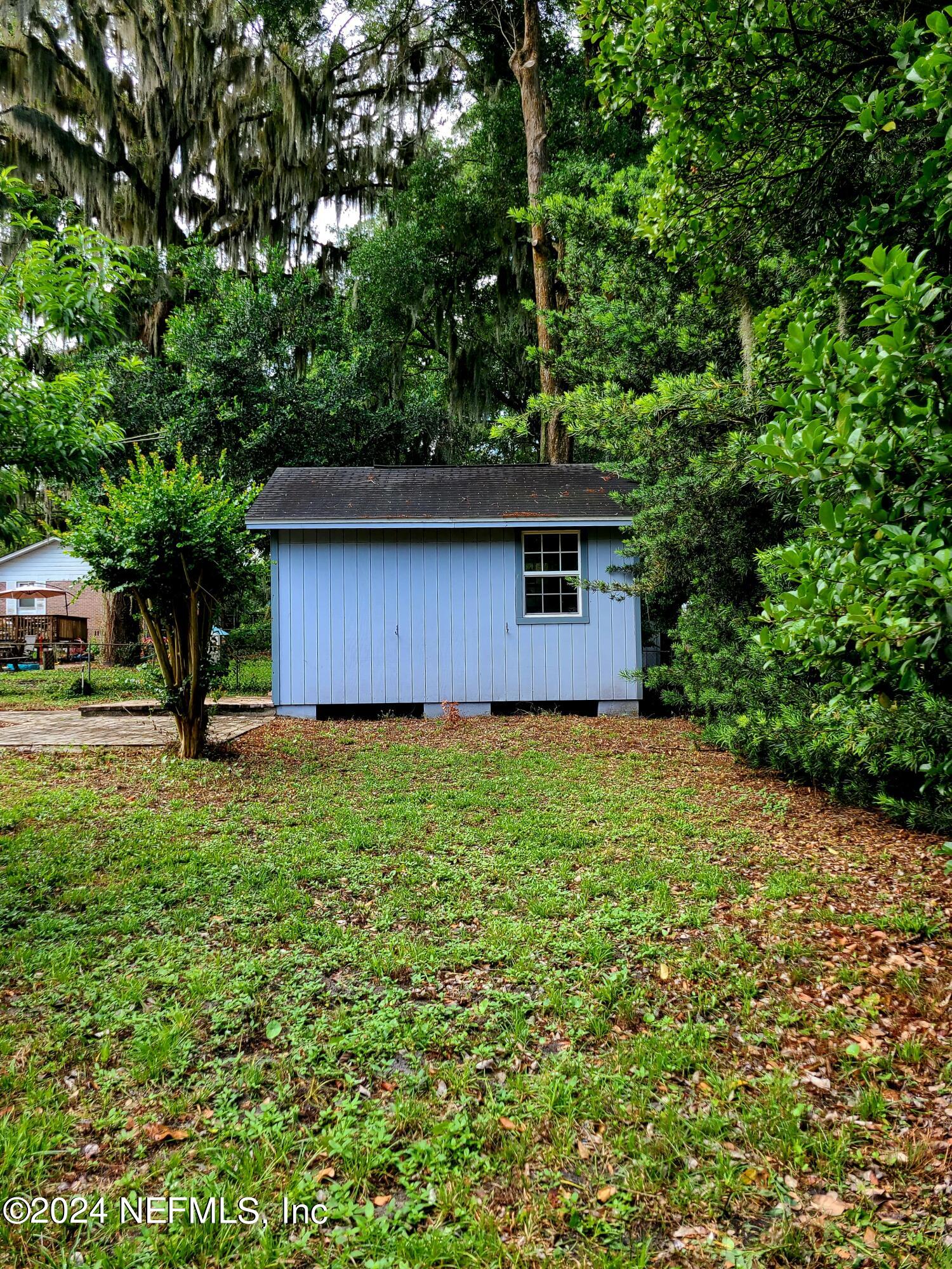 4620 Morris Road Jacksonville, FL 32225 - Photo 35 of 39 a backyard of a house with lots of green space