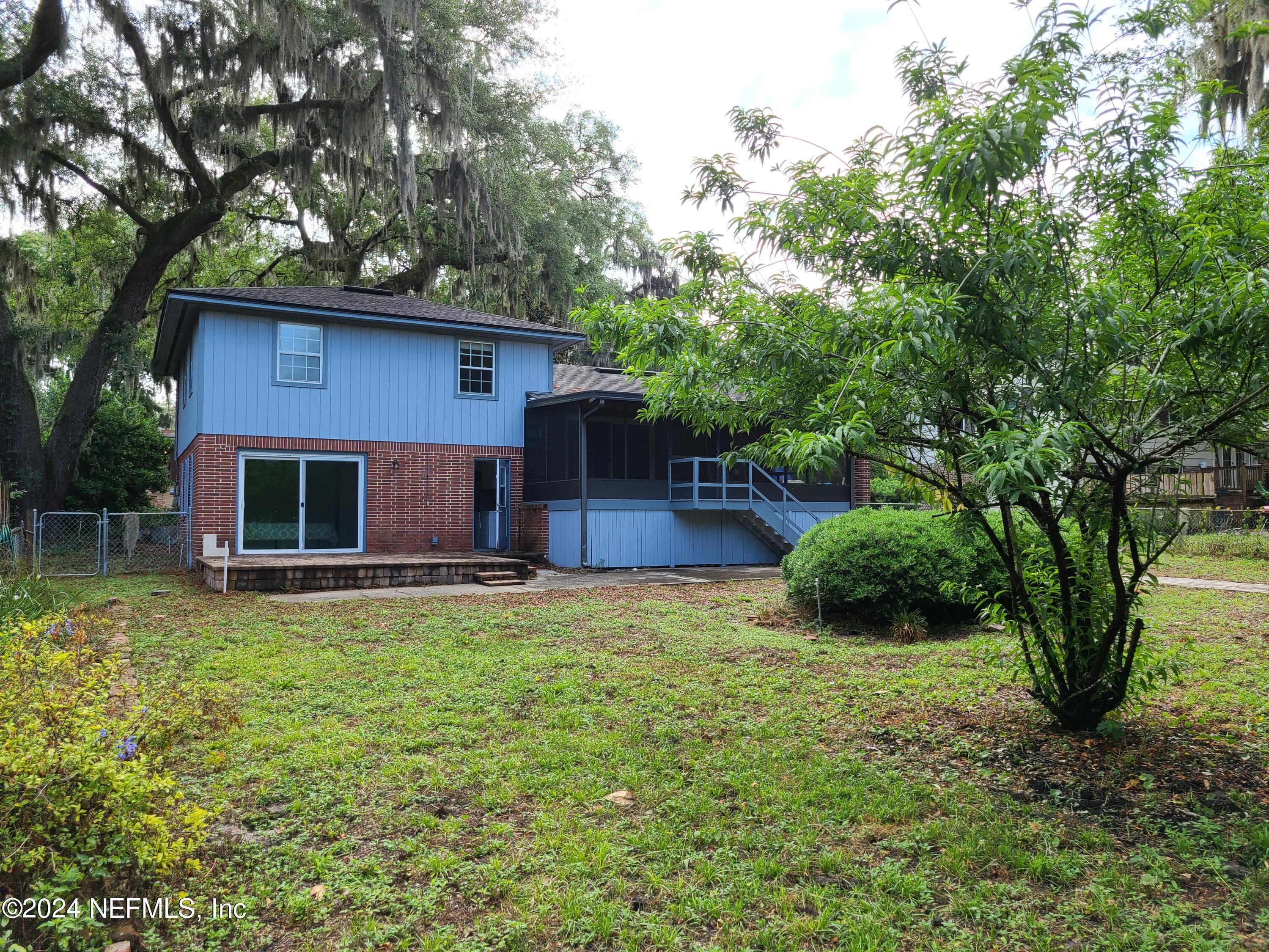 4620 Morris Road Jacksonville, FL 32225 - Photo 39 of 39 a view of a house with a yard and a large tree