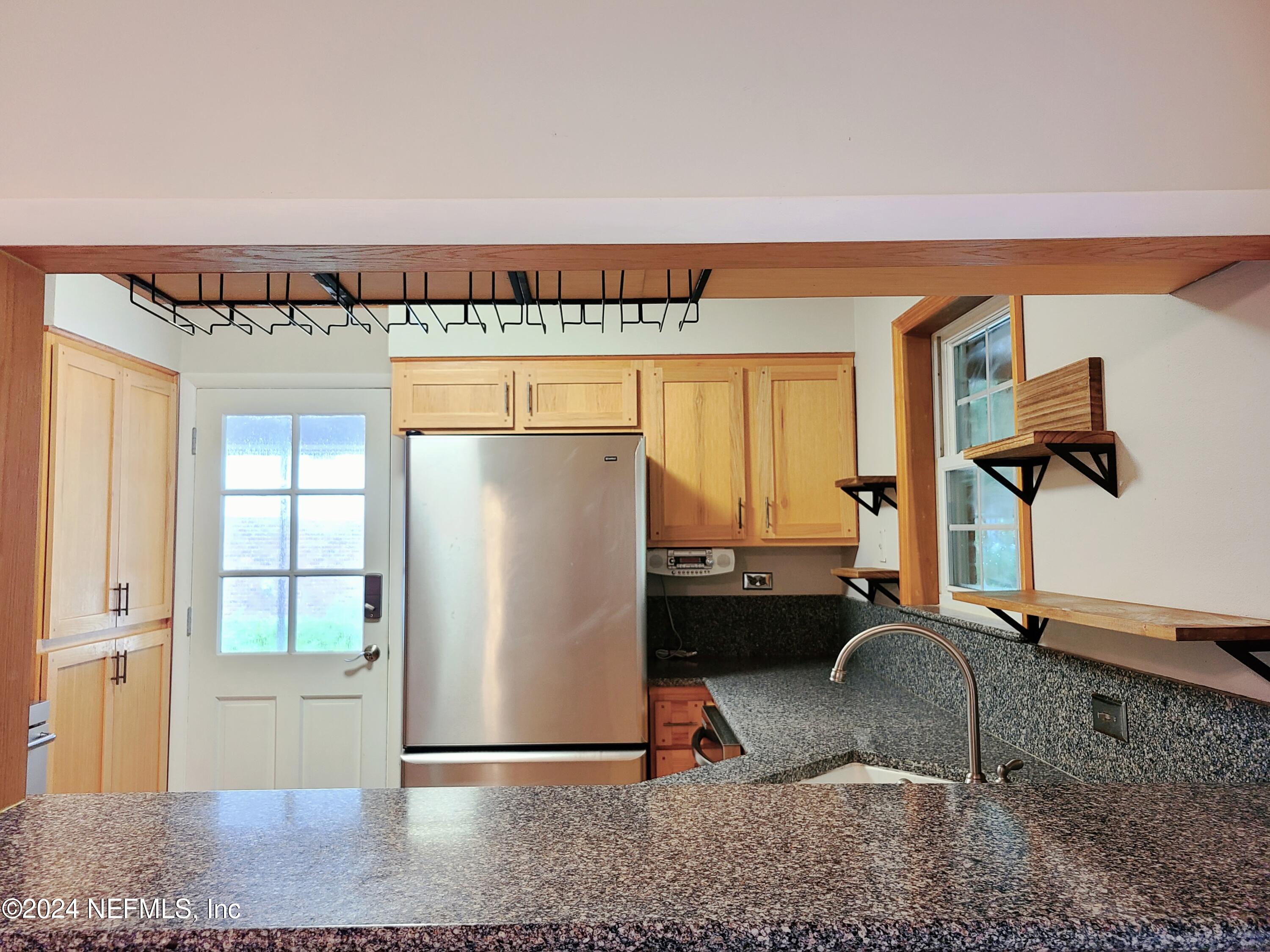 4620 Morris Road Jacksonville, FL 32225 - Photo 7 of 39 a room with a couch and a table