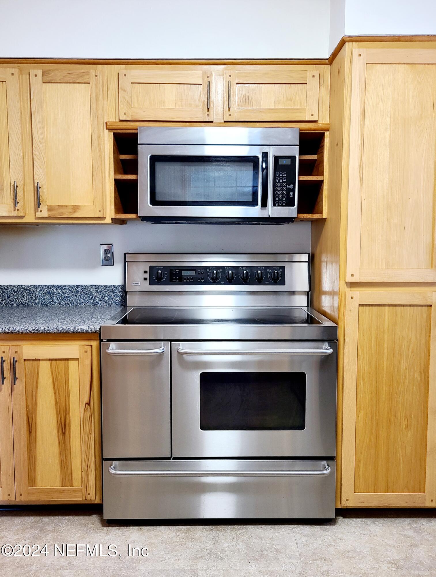 4620 Morris Road Jacksonville, FL 32225 - Photo 8 of 39 a stove top oven sitting inside of a kitchen