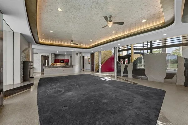 a kitchen with stainless steel appliances granite countertop a sink a stove and a refrigerator