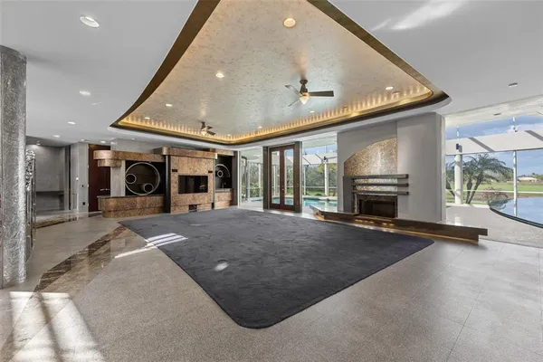 a large kitchen with stainless steel appliances granite countertop a refrigerator and stove